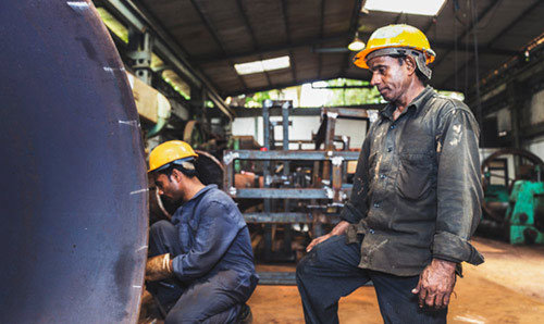 Men in hardhats in a workshop