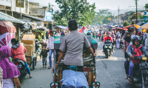 shot from behind of a Becak; Indonesia’s traditional rickshaw cycle taken in Bandung City, Indonesia