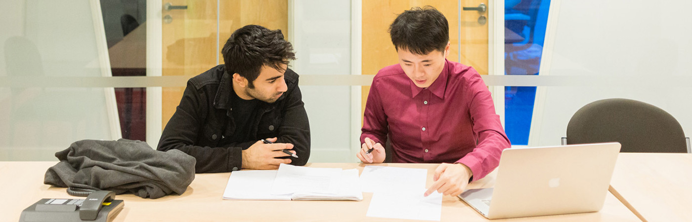 Two PhD GDI students in meeting