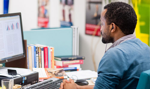 GDI student working on a computer
